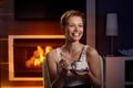 Happy woman with coffee in cosy room Royalty Free Stock Photo