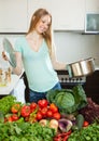 Happy woman cooking with pan and vegetables Royalty Free Stock Photo