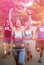 Happy woman crossing the finish line Royalty Free Stock Photo