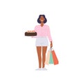 Happy woman customer cartoon female buyer character standing with shopping bags and sweet cake