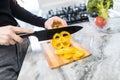 Close up of woman hands cut pepper for cooking vegetables salad at the kitchen Royalty Free Stock Photo