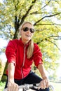 Happy woman cycling on bicycle Royalty Free Stock Photo