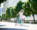 Attractive young woman enjoying riding her bicycle