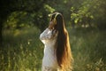 Girl with headphones dancing in field. Royalty Free Stock Photo