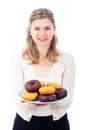 Happy woman with delicious sweet donuts