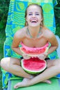 Happy woman with delicious watermelon