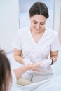 Masseuse makes a hand massage in the medical and cosmetology center Royalty Free Stock Photo