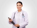 Happy woman, doctor and portrait with tablet in healthcare research or online advice against a studio background. Female Royalty Free Stock Photo