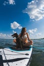 happy woman with dog on supboard
