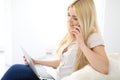 Happy woman doing online shopping at home . Close- up of a hand holding a credit card next to a laptop Royalty Free Stock Photo