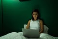 Happy woman doing online shopping at night Royalty Free Stock Photo