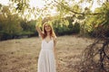 happy woman in a dress on nature near green leaves trees and bushes in the background Royalty Free Stock Photo