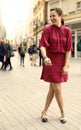 Independent woman dressed in red laughing a lot with positive emotions