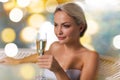 Happy woman drinking champagne at swimming pool Royalty Free Stock Photo