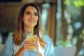 Happy Woman Drinking a Lemonade in a Restaurant Royalty Free Stock Photo