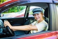 Happy smiling woman driver behind the wheel red car Royalty Free Stock Photo