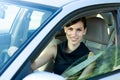 Happy woman driving the car