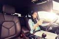 Happy woman driving car with smarhphone Royalty Free Stock Photo