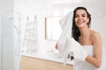 Happy woman drying hair with towel after washing in bathroom. Space for text Royalty Free Stock Photo