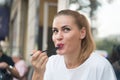 Happy woman eat with fork in restaurant in paris, france Royalty Free Stock Photo