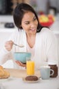 happy woman eating bowl cereal Royalty Free Stock Photo