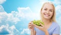 Happy woman eating grapes over sky Royalty Free Stock Photo