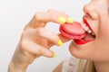 Happy woman eating macaroon Royalty Free Stock Photo