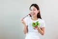 Happy woman eating salad vegetables. Royalty Free Stock Photo