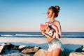 Happy woman eating watermelon on the beach. Royalty Free Stock Photo