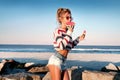 Happy woman eating watermelon on the beach. Royalty Free Stock Photo