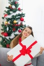 Happy woman embracing big Christmas present box Royalty Free Stock Photo