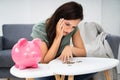 Happy Woman Emptying Her Piggybank Savings
