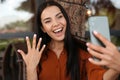 Happy woman with engagement ring taking selfie in outdoor cafe Royalty Free Stock Photo