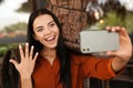 Happy woman with engagement ring taking selfie in outdoor cafe Royalty Free Stock Photo