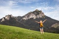 Happy woman enjoying hiking in mountains