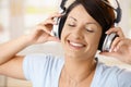 Happy woman enjoying music on headphones Royalty Free Stock Photo