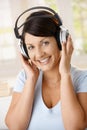 Happy woman enjoying music on headphones Royalty Free Stock Photo