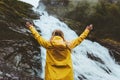 Happy woman enjoying waterfall view Traveling into the wild Royalty Free Stock Photo