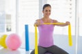 Happy woman exercising at fitness studio Royalty Free Stock Photo