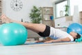 happy woman exercising abs on pilates ball indoors Royalty Free Stock Photo