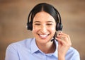 Happy woman, face and headset at callcenter, contact us and customer service agent with smile. CRM, phone call and tech