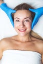 Happy woman after facial massage, young and fresh female in spa, beauty theraphy, copy space