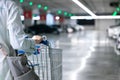 Happy woman female with closeup shopping cart or trolley in car parking of fresh maket for healthy housewife in supermarket store