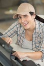 Happy woman fixing printer Royalty Free Stock Photo