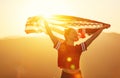 Happy woman with flag of united states enjoying the sunset on na Royalty Free Stock Photo