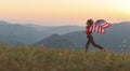 Happy woman with flag of united states enjoying the sunset on na Royalty Free Stock Photo