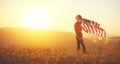 Happy woman with flag of united states enjoying the sunset on na Royalty Free Stock Photo