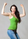 Happy woman flexing muscles