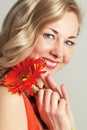 Happy woman with a flower.