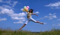 Happy woman flying with colorful balloons